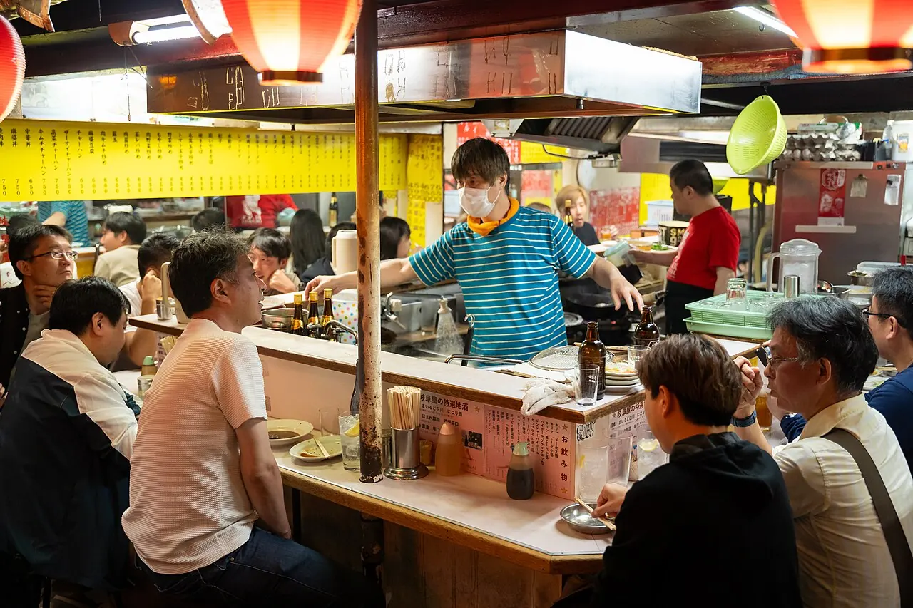Shoulder to shoulder at a counter in Omoide Yokocho, Shinjuku, Tokyo